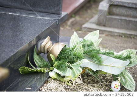 close up on broken flowers on the gravestone close up on broken flowers on the gravestone 24193502