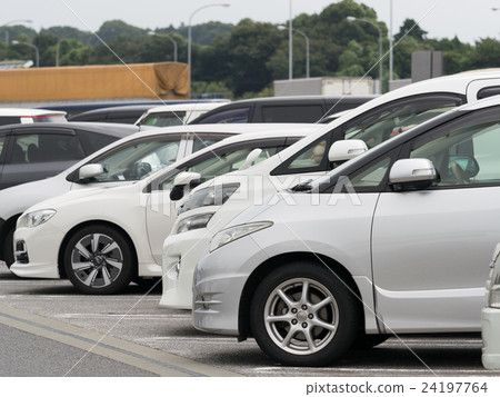 Passenger cars lining up in the parking lot 24197764