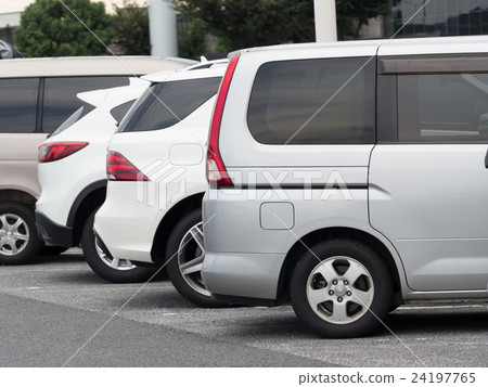 Passenger cars lining up in the parking lot 24197765