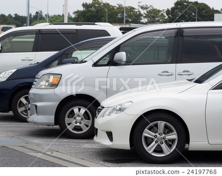 Passenger cars lining up in the parking lot 24197768