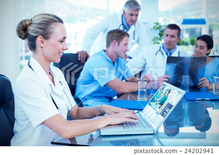 Composite image of beautiful smiling doctor typing on keyboard w 24202941