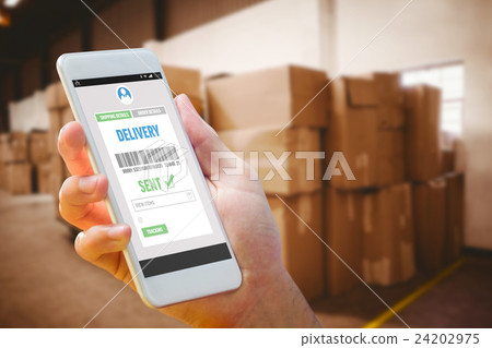 Composite image of hand holding smartphone Composite image of hand holding smartphone 24202975