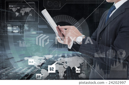Composite image of businessman in suit using digital tablet 24202997