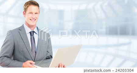 Composite image of happy businessman with laptop 24203304