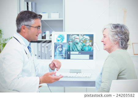Composite image of smiling surgeon posing with a team 24203582