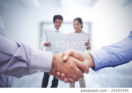 Composite image of men shaking hands Composite image of men shaking hands 24203595