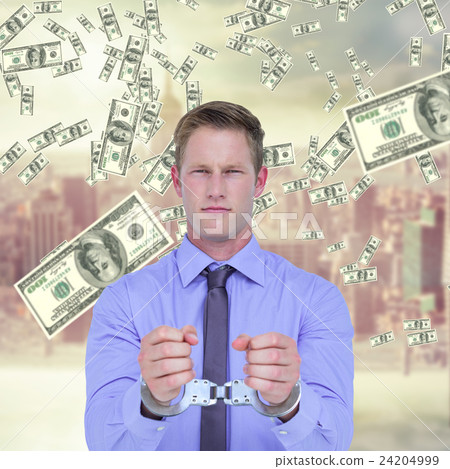 Composite image of handsome businessman wearing handcuffs Composite image of handsome businessman wearing handcuffs 24204999