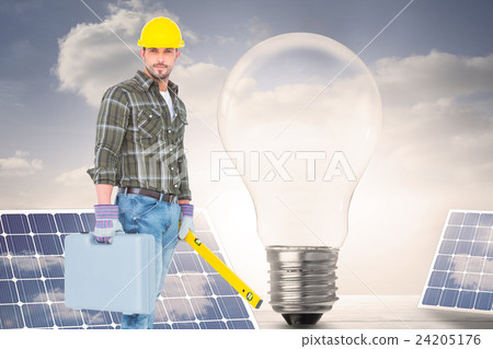 Composite image of manual worker with spirit level and toolbox 24205176