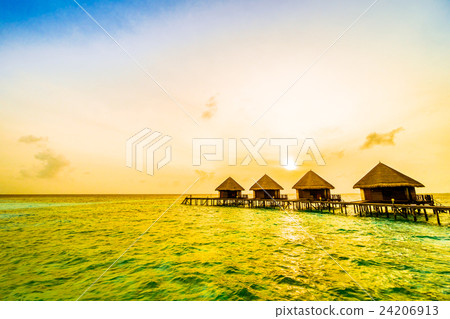 Sunset over maldives island 24206913