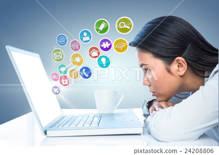 Composite image of worried businesswoman in front of her laptop  24208806
