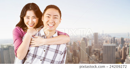 Composite image of smiling man gives girl a piggy back Composite image of smiling man gives girl a piggy back 24209272