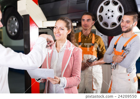 Mechanics and happy customer 24209550