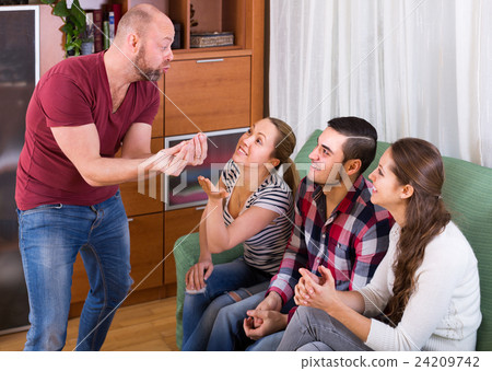 adults playing charades 24209742