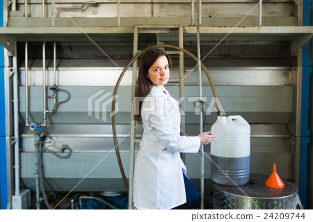 girl with pot at olive oil industry 24209744