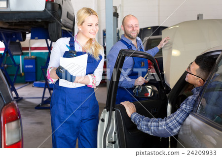 People at a car repair shop People at a car repair shop 24209933