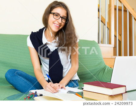 Teenager girl doing homework 24209973