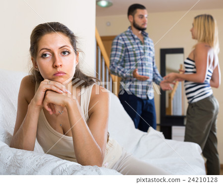 person keeping silence turned away from friends 24210128