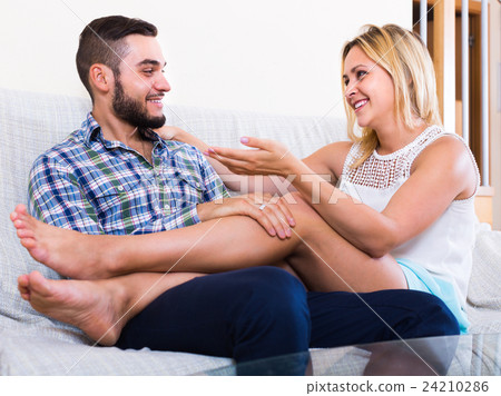 Couple talking at home 24210286