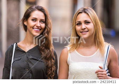 portrait of beautiful young women having a walk portrait of beautiful young women having a walk 24210411