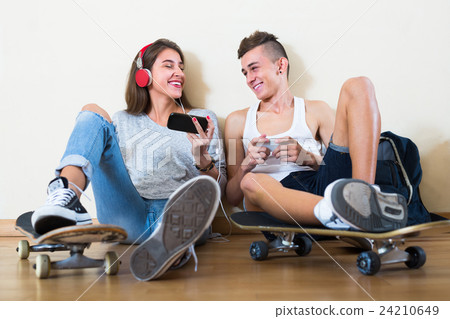 Girl and boy playing games online 24210649