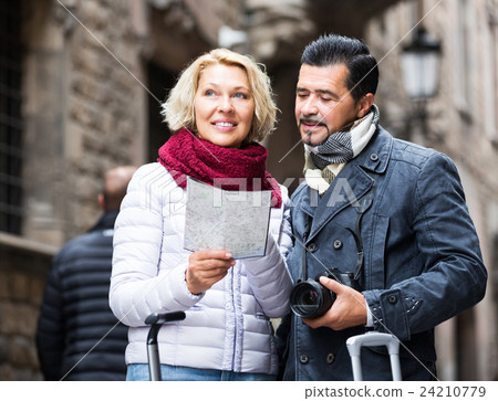 Tourists with map and luggage 24210779