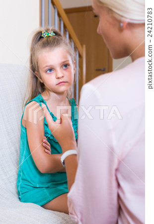 Woman scolding little daughter Woman scolding little daughter 24210783