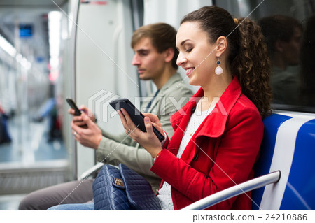 Passengers reading in metro wagon. Passengers reading in metro wagon. 24210886