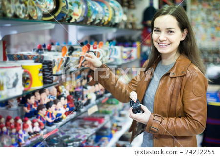 Female customer buying things for memory Female customer buying things for memory 24212255