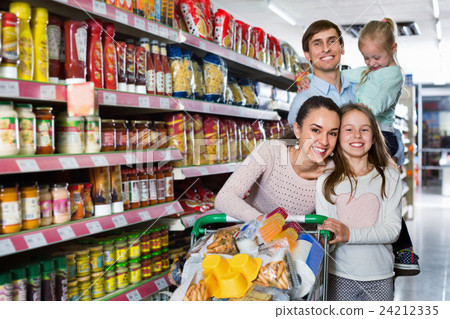 Charming customers with children buying food in hypermarket 24212335