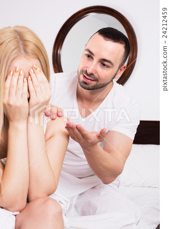 Husband Comforting Wife In Bedroom Stock Photo 24212459