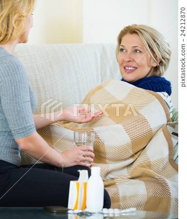 Portrait of sick female pensioner and her careful daughter Portrait of sick female pensioner and her careful daughter 24212870