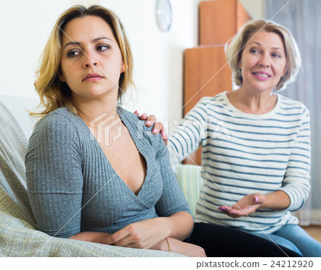 Old woman fawning on daughter in law after quarrel 24212920