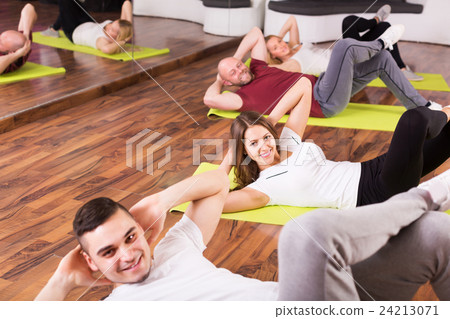 Fitness coach showing new exercise 24213071