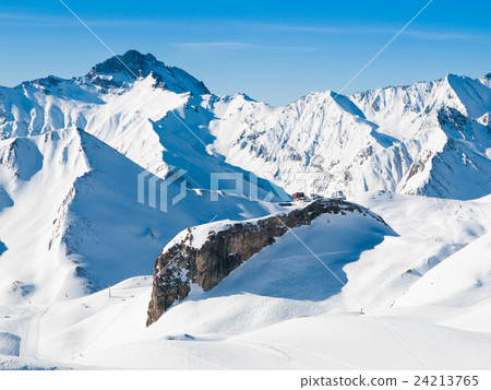 Sunny winter day in alpine ski resort Sunny winter day in alpine ski resort 24213765