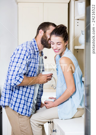 Young couple having fun in kitchen Young couple having fun in kitchen 24216522