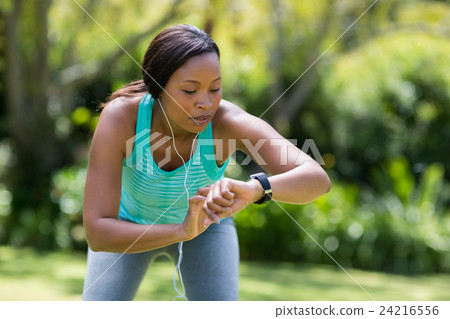 Woman looking her watch Woman looking her watch 24216556