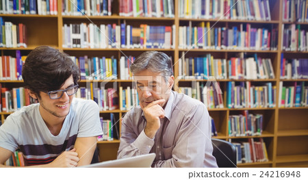 Professor assisting a student with studies Professor assisting a student with studies 24216948