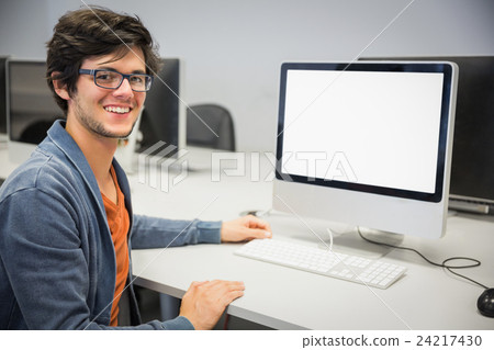 Portrait of happy student using computer 24217430