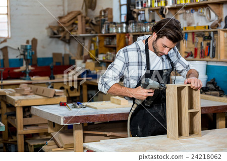 Carpenter working on his craft Carpenter working on his craft 24218062