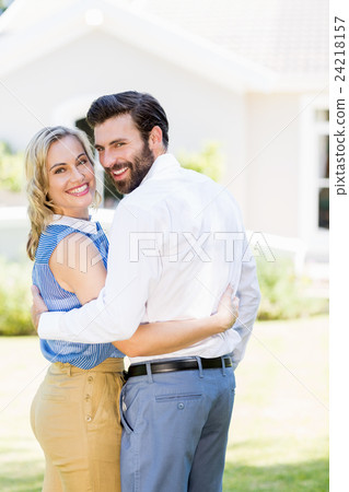 Portrait of happy couple embracing each other Portrait of happy couple embracing each other 24218157