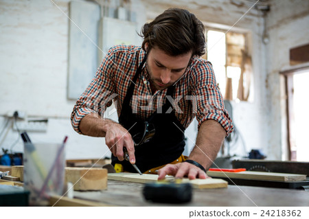 Carpenter working on his craft 24218362