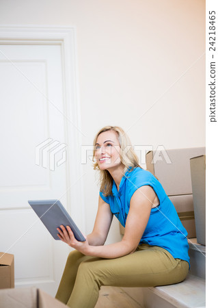 Young woman using digital tablet 24218465