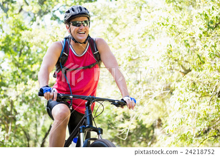 Mature man riding bike Mature man riding bike 24218752