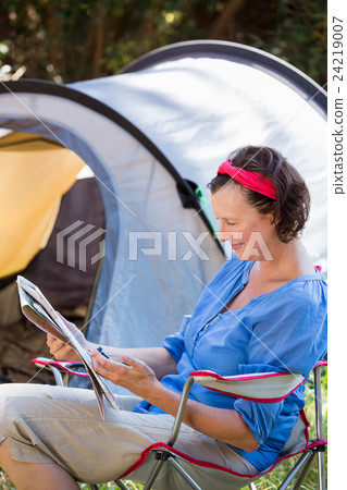 senior woman is reading  24219007