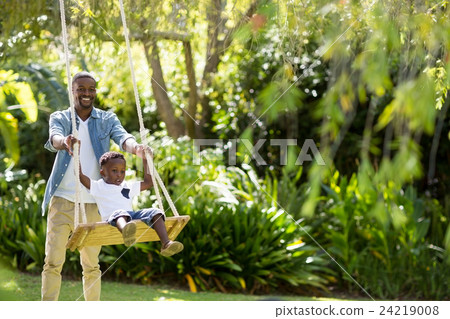 Happy family doing swing 24219008