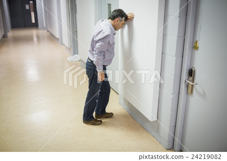 Worried professor leaning on wall 24219082
