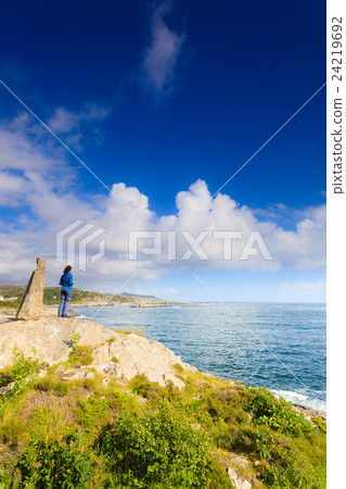 Woman tourist looking at ocean in Norway 24219692