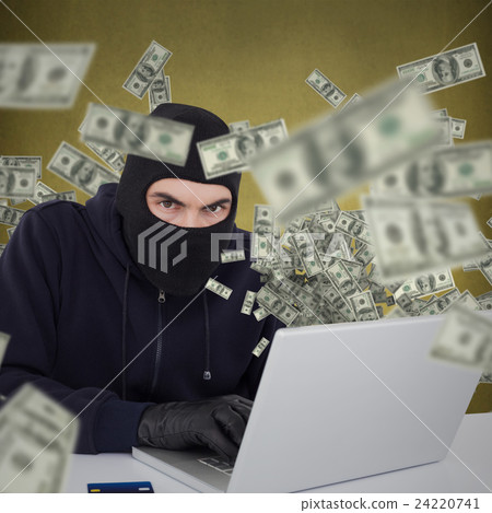 Composite image of hacker in balaclava hacking a laptop Composite image of hacker in balaclava hacking a laptop 24220741