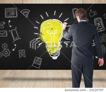 Composite image of businessman standing back to camera writing with marker Composite image of businessman standing back to camera writing with marker 24220797