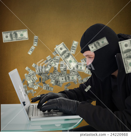 Composite image of robber sitting at desk hacking a laptop Composite image of robber sitting at desk hacking a laptop 24220988